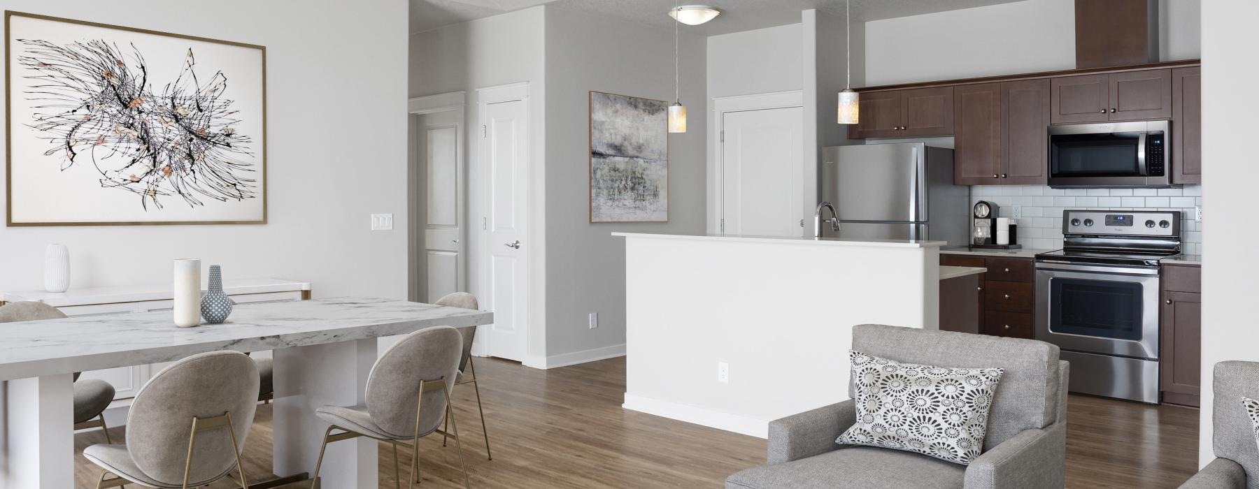 a kitchen with a dining table and chairs