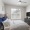 bedroom with a tv and a large window