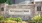 a sign on a stone wall