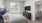 a bedroom with a large window and easy access to the living room