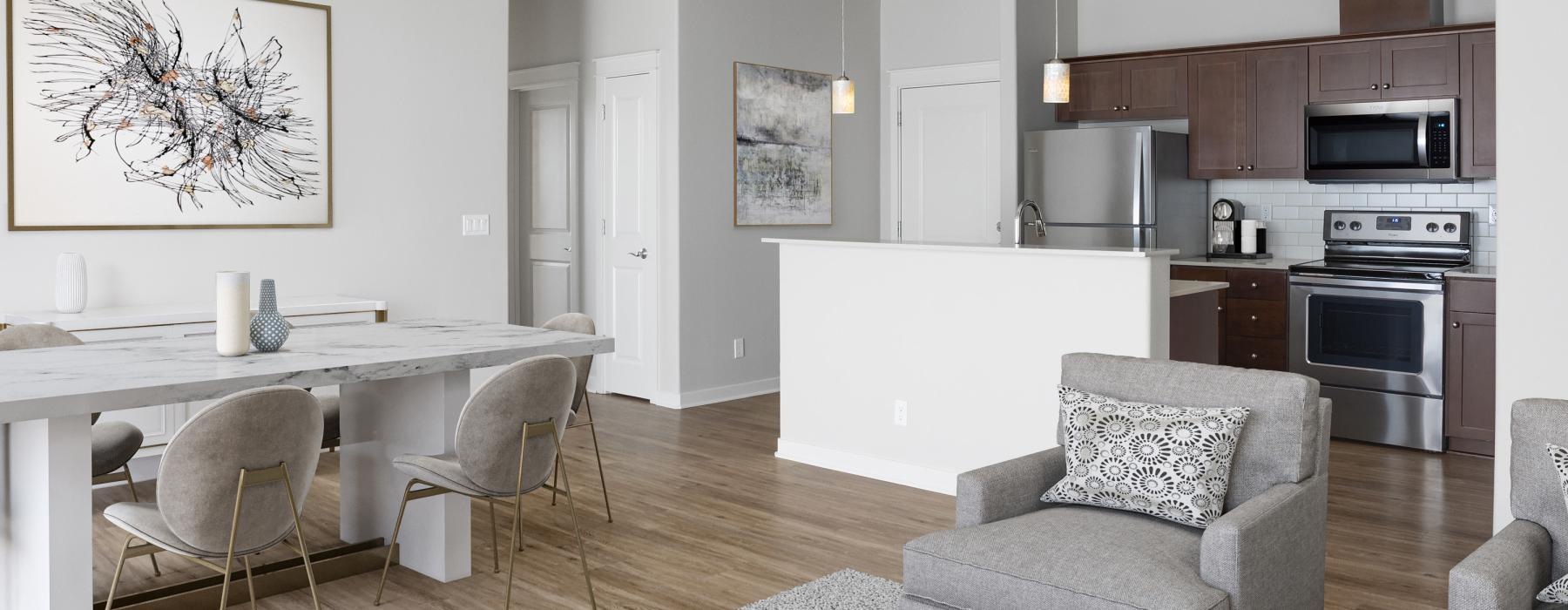 a kitchen with a dining table and chairs